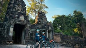 cyclists angkor temple gate exploration