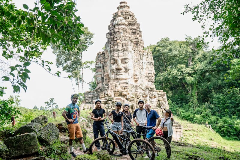 E-MTB guest at the quiet Ta Kav gate of Angkor in Siem Reap Cambodia