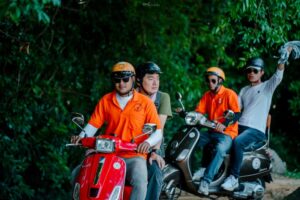 Guest smiling and looking super happy during a Vespa tour in Siem Reap