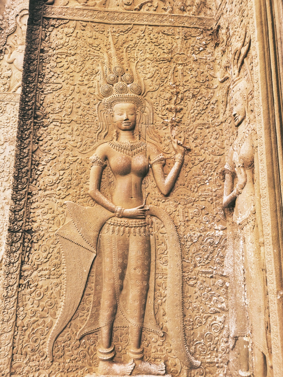 Detailed apsara devata carving at Angkor Wat showing intricate Khmer craftsmanship