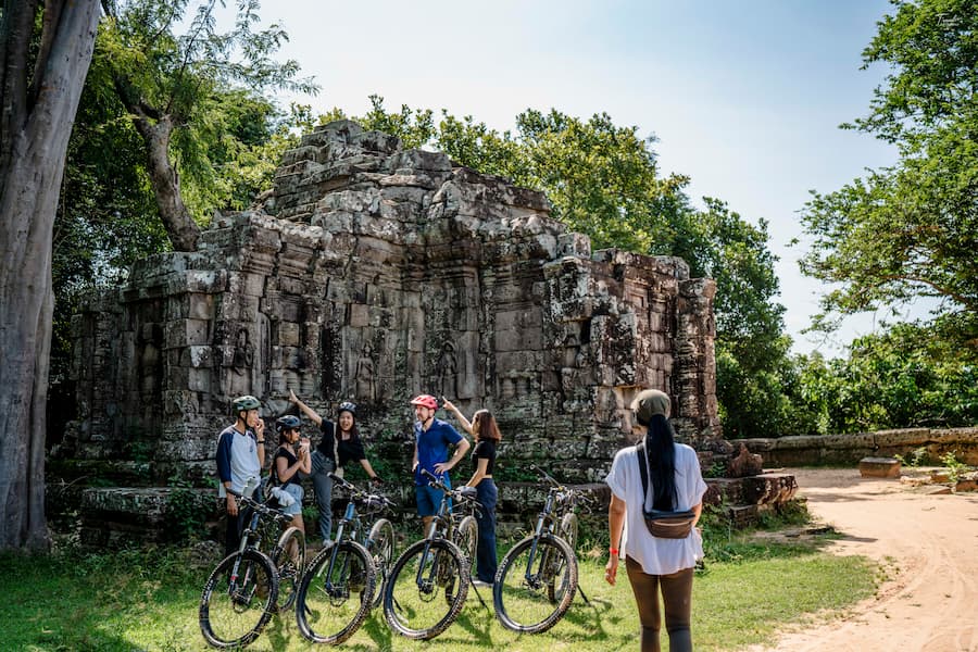 Riding on top of Angkor Thom's wall, near the Gate of the Dead