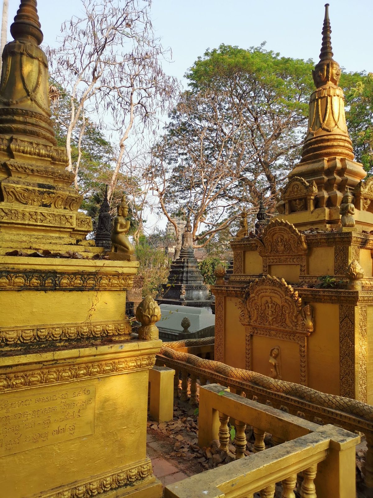 Golden stupas at a working Buddhist pagoda near Siem Reap