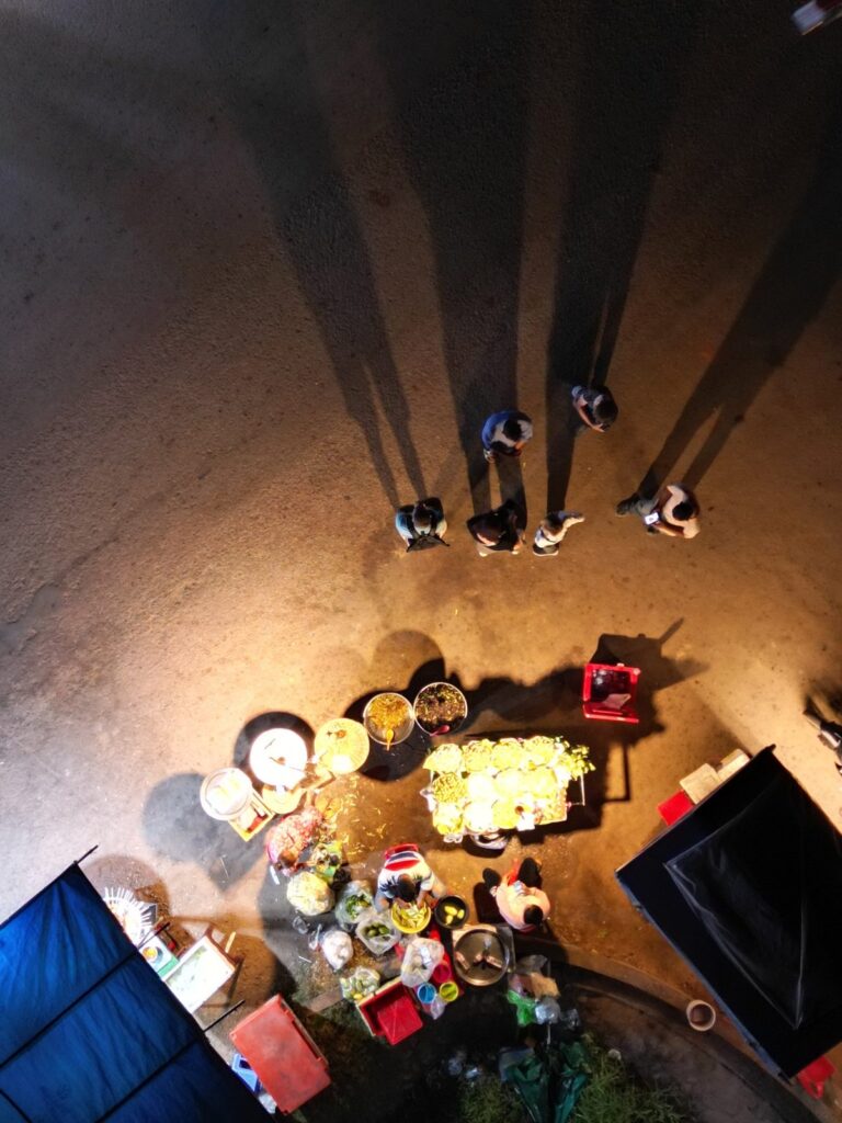 Top-down view of a Siem Reap street-food vendor and customers.