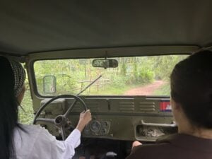 The view forward from inside the Jeep on a narrow village track